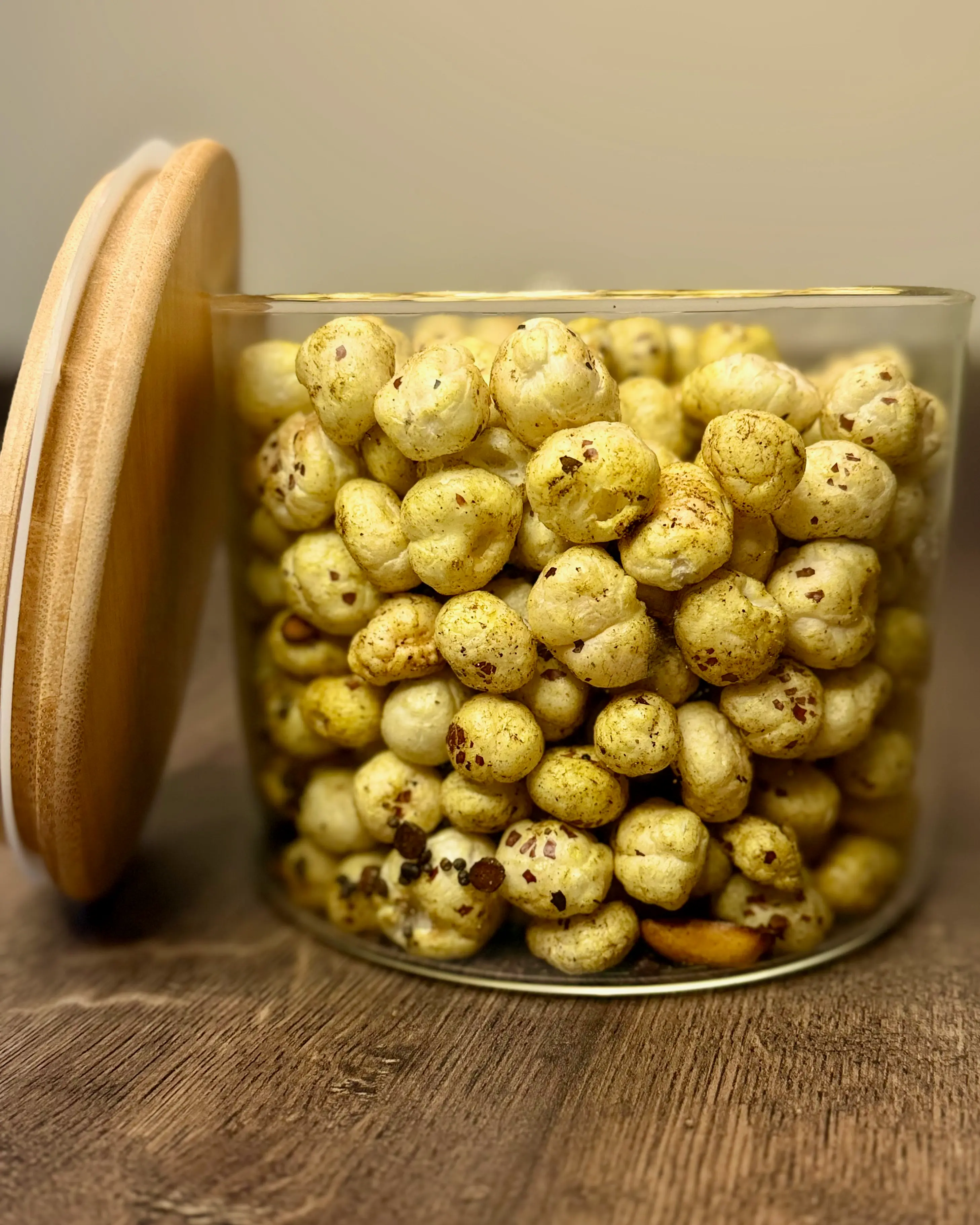 Homemade seasoned makhana in a glass jar